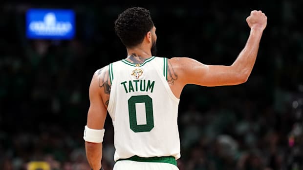 Jayson Tatum fist pumps during a game.